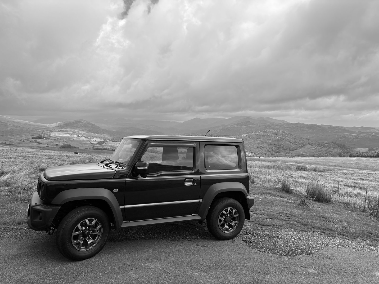 Jimny side profile in the Welsh mountains